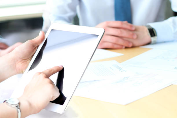 istock Business colleagues working and analyzing financial figures on a digital tablet 660591150
