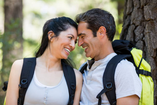 istock Couple smiling and holding each other 660594022
