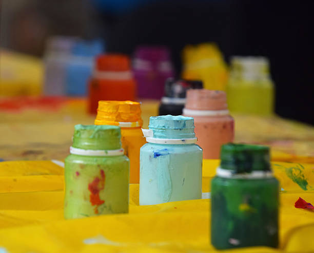 istock Close-Up Of Paint Bottles On Table 660596911