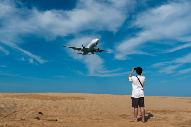 istock Taking photo of airplane landing. 660598518