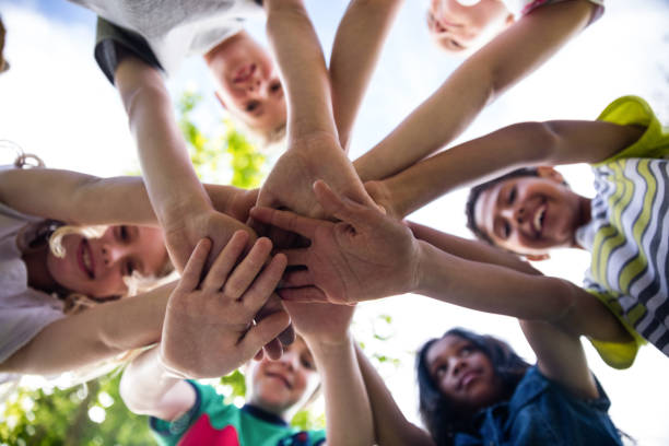 istock Children putting their hands together 660605786