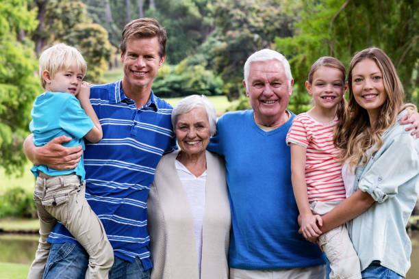 istock Multi-generation family standing in the park 660610420