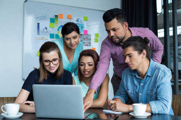 istock Businesspeople having discussion over laptop in office 660611368
