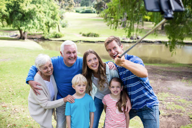 istock Multi-generation family taking a selfie with selfie stick 660613460