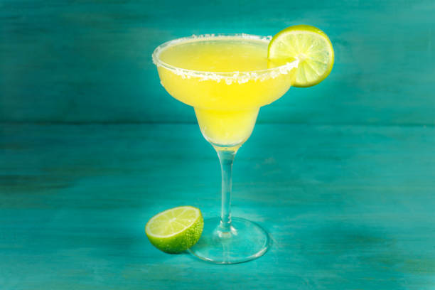 istock Lemon Margarita cocktails on vibrant turquoise with copyspace 660616946