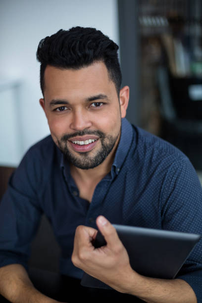 istock Portrait of business executive using digital tablet in office 660617634