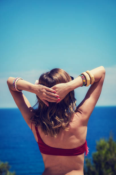 istock Girl enjoying outdoors with ocean / sea background. 660618646