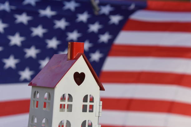 istock Small House on American Flag 660621752