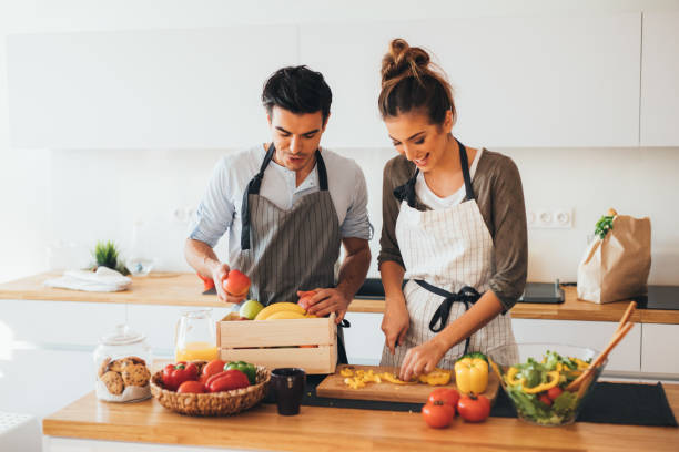Young couple cooking in the kitchen