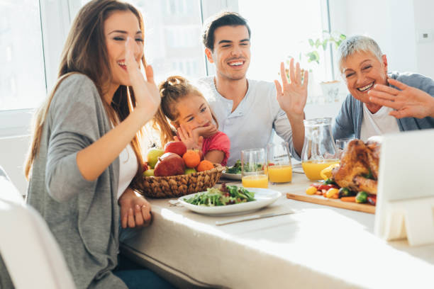 istock Family having a video call during dinner 660622008