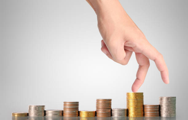 istock Hand human hand putting coin to money 660626878