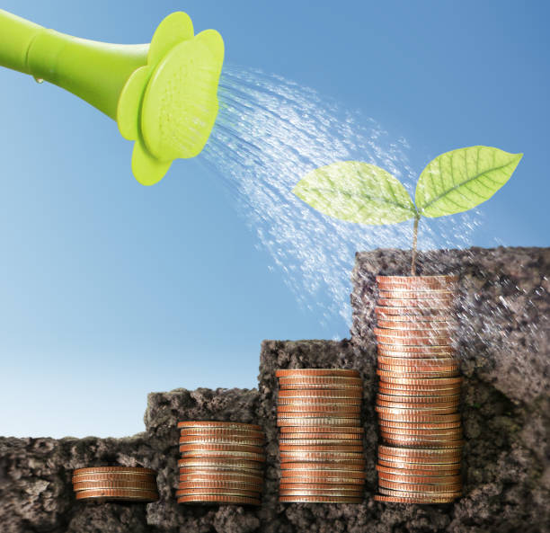 istock Coins graph stock market 660626892