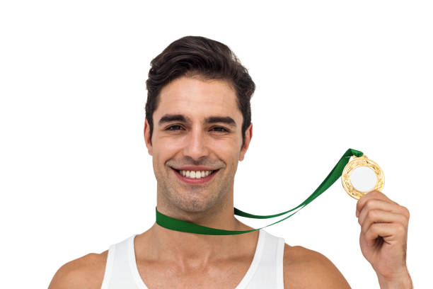istock Athlete posing with gold medals around his neck 660630752