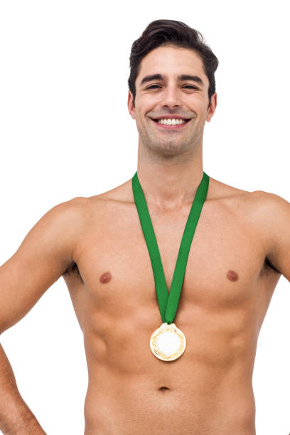 istock Athlete posing with gold medal on white background 660631106