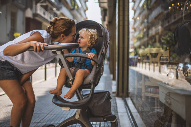 istock Mother with pram in city walk 660631230