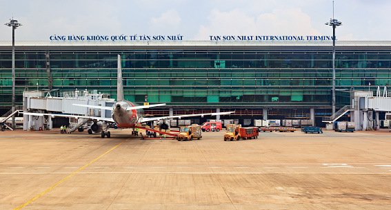 Ho Chi Minh: Aircraft of asian low cost airline Jet Star Air preparing for flight in front of passenger terminal building in Ho Chi Minh ( Saigon ) International Airport.