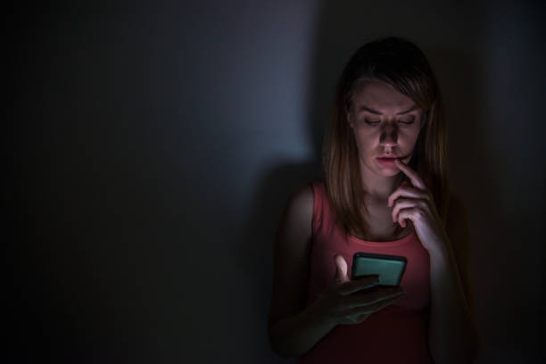 istock young sad vulnerable girl using mobile phone scared and desperate 660640352