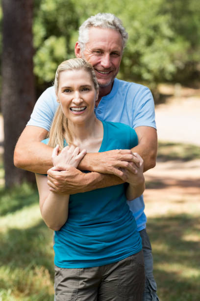 istock Couple smiling and holding each other 660640660