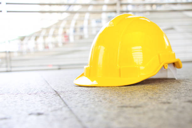 istock Yellow safety hat is on the floor 660643500