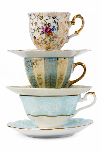 Decorated antique porcelain tea cups with  saucers.