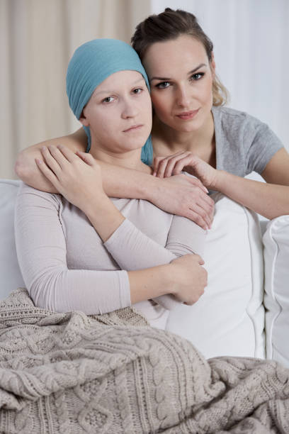 istock Woman hugging her ill sister 660644520