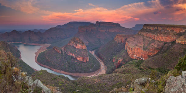 Blyde River Canyon in South Africa at sunset View over the Blyde River Canyon and the Three Rondavels in South Africa at sunset. blyde river canyon stock pictures, royalty-free photos & images