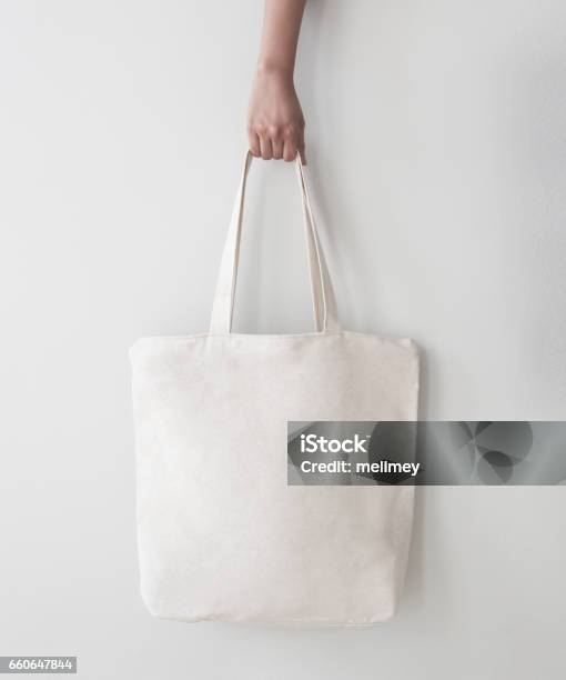 Blank Canvas Tote Bag Design Mockup With Hand Handmade Shopping Bags Stock Photo - Download Image Now