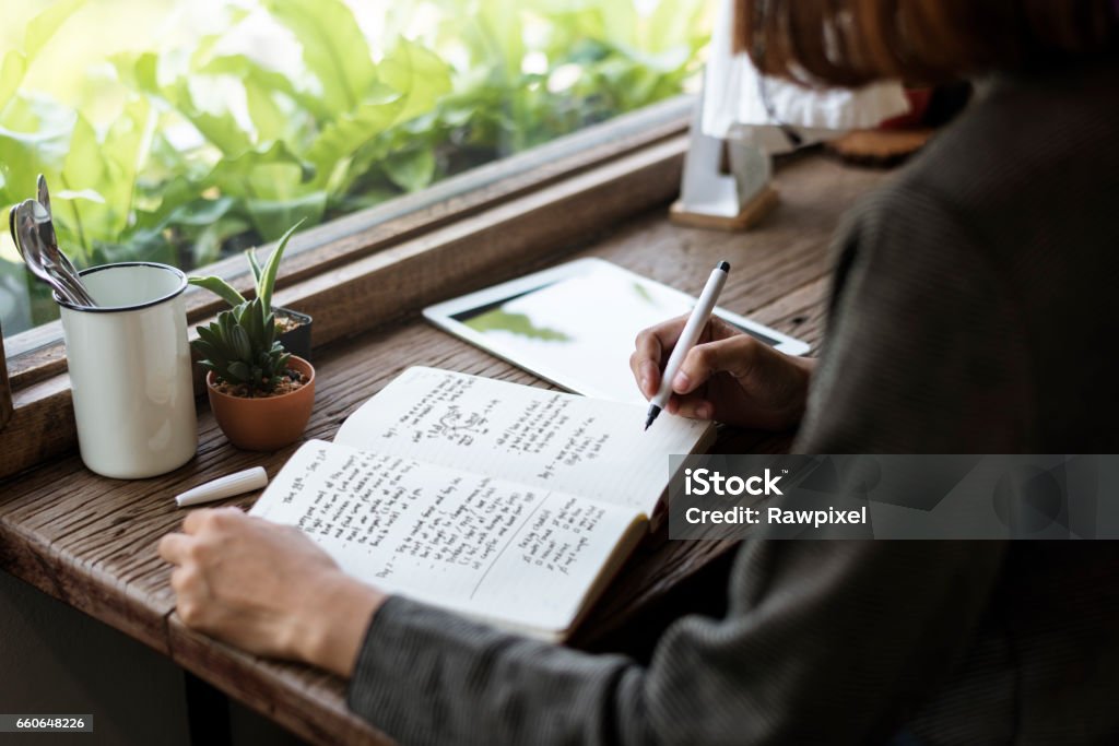 Girl with Glasses Sitting Wooden Table Workplace Writing - Activity Stock Photo