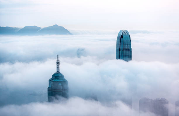 istock Clouds rolling over Hong Kong Victoria Harbor at misty season 660650410
