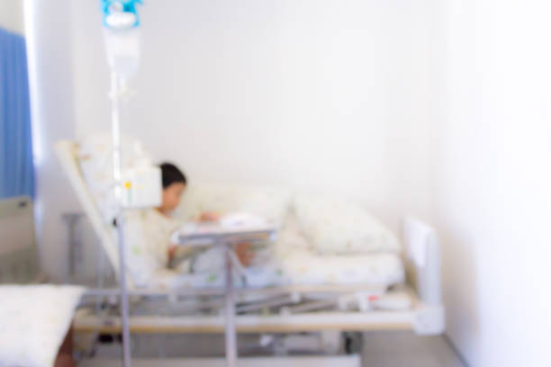 Private Room In Modern Hospital With Empty Bed And Medical Tech Equipment