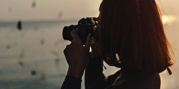 istock Woman Taking Snap Photo with Camera Wanderlust 660654706