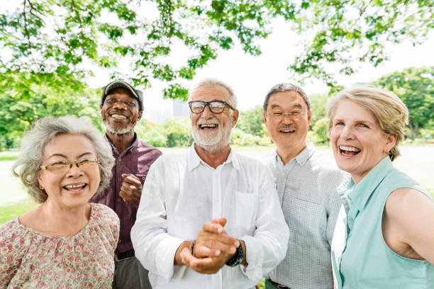 Group of Senior Retirement Friends Happiness Concept Group of Senior Retirement Friends Happiness Concept group of people laughing stock pictures, royalty-free photos & images