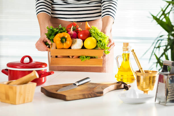 istock Woman holding vegetables in crate 660656030