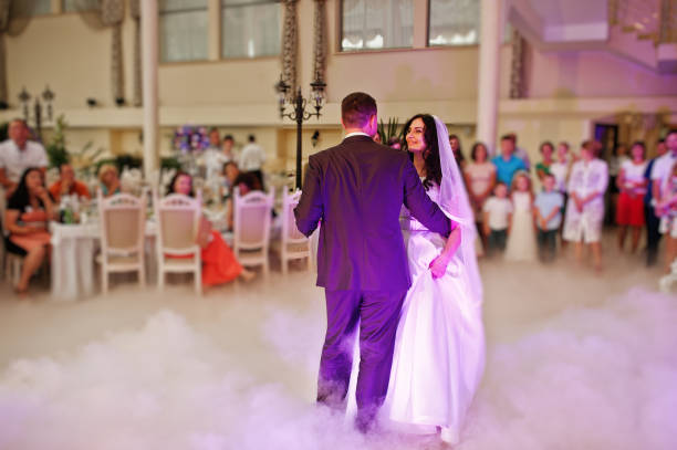 istock Awesome first wedding dance with smoke and rose purple lights. 660667060