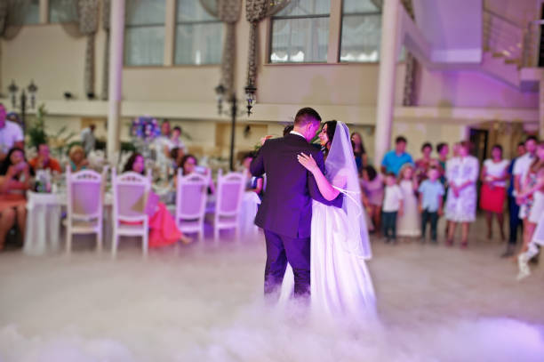 istock Awesome first wedding dance with smoke and rose purple lights. 660667062