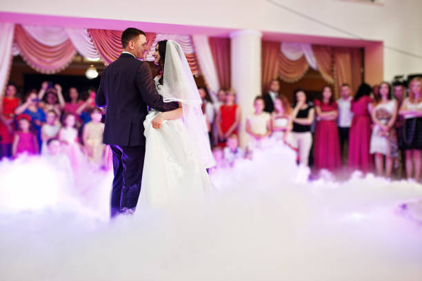 istock Awesome first wedding dance with smoke and rose purple lights. 660667106
