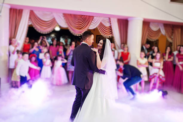 istock Awesome first wedding dance with smoke and rose purple lights. 660667146