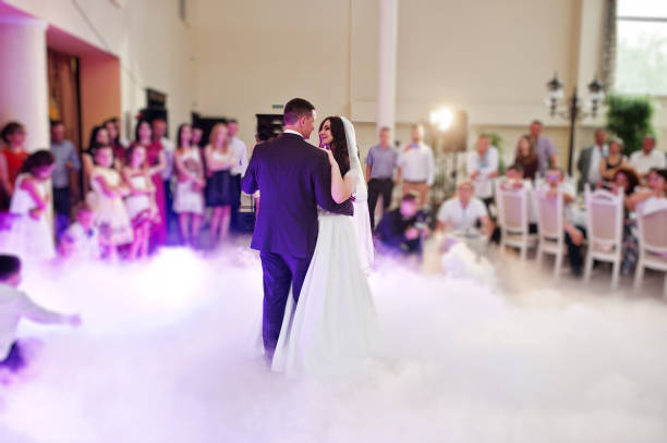 istock Awesome first wedding dance with smoke and rose purple lights. 660667158