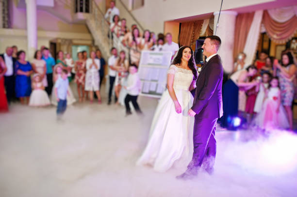 istock Awesome first wedding dance with smoke and rose purple lights. 660667174