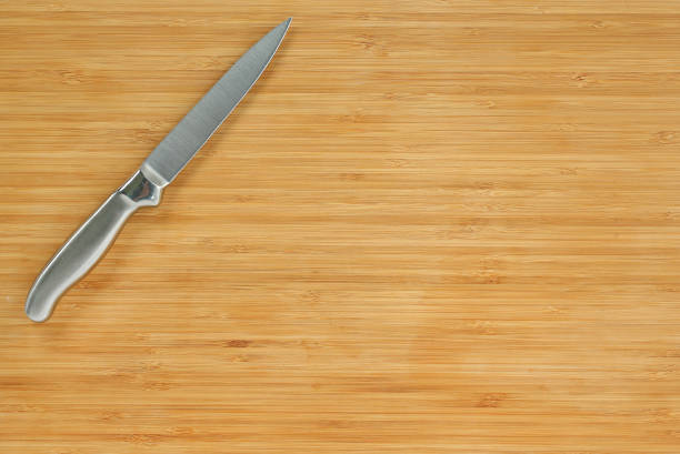 istock Steel kitchen knives on a wood board. 660669806