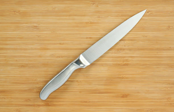 istock Steel kitchen knives on a wood board. 660670186