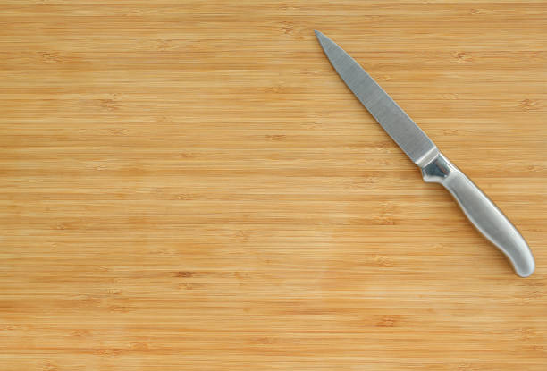 istock Steel kitchen knives on a wood board. 660670332
