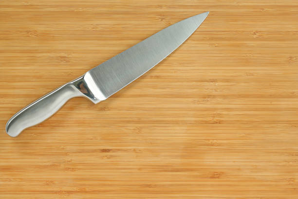 istock Steel kitchen knives on a wood board. 660670766