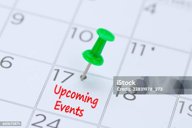 Upcoming Events Written On A Calendar With A Green Push Pin To Remind You And Important Appointment Stock Photo - Download Image Now