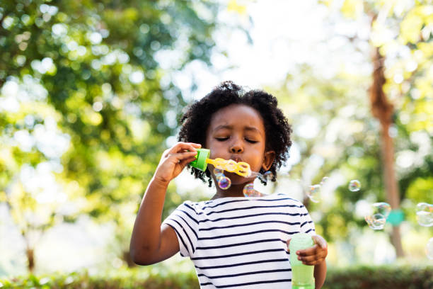 istock Bubble Blowing Kid Leisure Girl Joy Casual 660670904