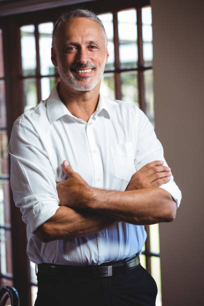 istock Smiling man with arms crossed 660671776