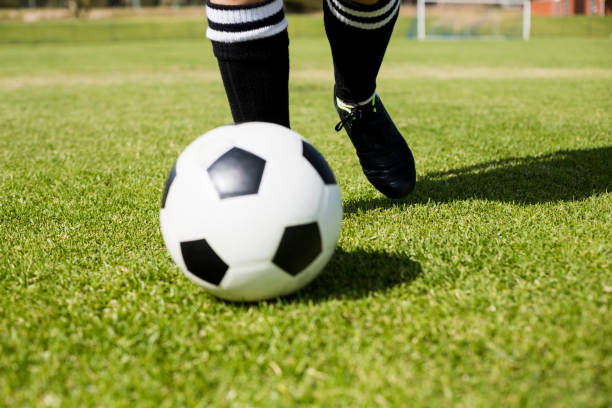 istock Female football player practicing soccer 660673886