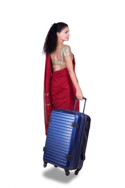 istock Woman with red saree and suitcase 660677356
