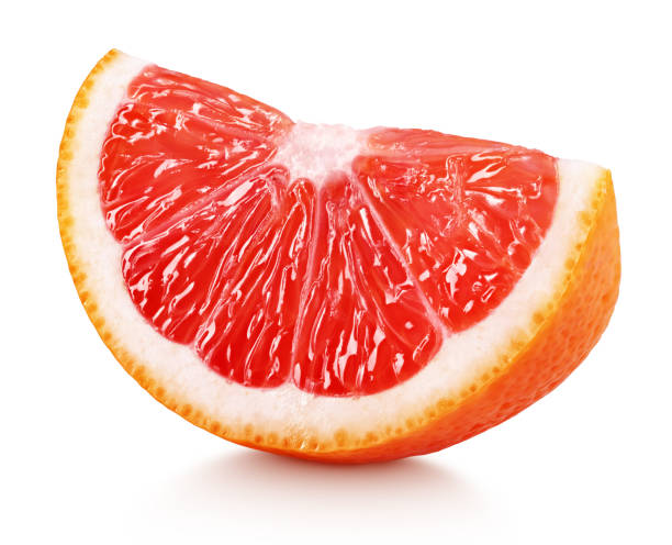 wedge of pink grapefruit citrus fruit isolated on white Ripe slice of pink grapefruit citrus fruit isolated on white background with clipping path cross section isolated objects food and drink isolated on white stock pictures, royalty-free photos & images