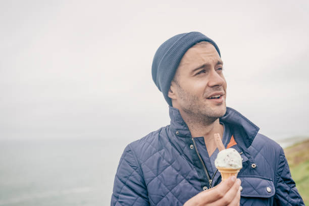 istock man with ice cream at the Cornish coast, Newquay. 660681366
